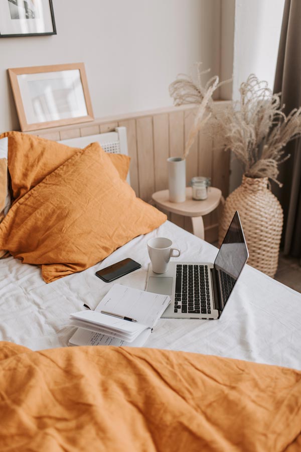 woman-entrepreneur-laptop-bed-home-2-opdb-op614084b9e2f946-66620536